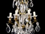 an image of a crystal chandelier hanging from a ceiling