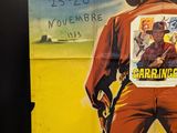 a poster of a man in a cowboy outfit on a wall