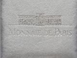 a close up of a book with a white house on it