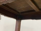 a wooden table with a drawer on top of it