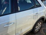 a white car that is parked next to other cars