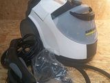 a vacuum that is sitting on the floor next to a cord