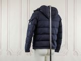 the jacket is blue and has a zipper on the back