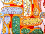 a scarf with a picture of a bunch of different things on it