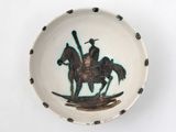 a bowl with a picture of a man on a horse on it