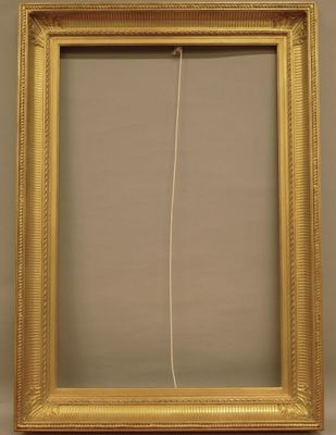 a gold frame with a white string hanging from it ' s side