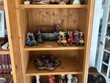 a wooden cabinet with a lot of items on it
