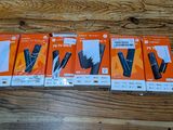four boxes of nintendo wii remotes sitting on a wooden table