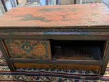 an old wooden table with a drawer on top of it