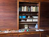 a room with a bookcase and a couch in it