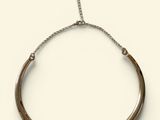 a close up of a bracelet on a white background
