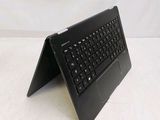 a black laptop with a black keyboard on a white surface
