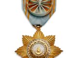 l'image d'une médaille surmontée d'une étoile