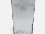 a glass that is sitting on a white surface