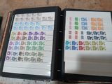 a binder with a lot of different stamps on it