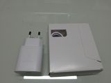 a white box with a charger attached to it on a table