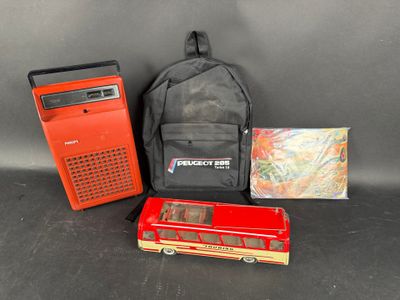 a backpack, a radio, a backpack, and other items on a table