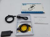 a box with a cable and a charger on a table