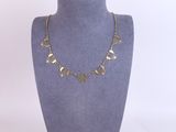 a close up of a mannequin with a necklace on it