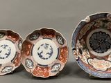 three different types of plates with designs on them on a gray surface