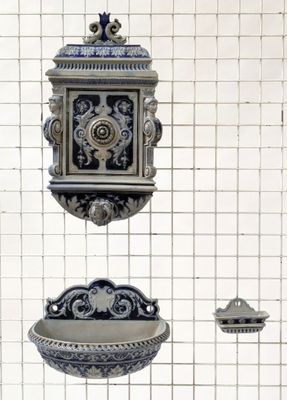 three decorative objects hanging on the wall in the room