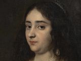 portrait of a woman in a white dress with a black bow