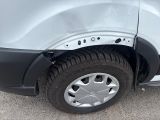 a close up of a car tire with a hole in the tire