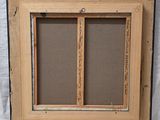 a close up of a picture of a window with a wooden frame