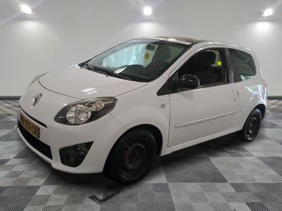 a picture of a small white car parked in a garage