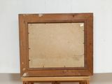 an old wooden easel with a piece of paper on top of it