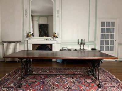 an image of a dining room with a table and chairs