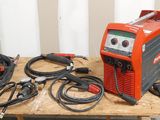 an image of a table with a bunch of wires and a welding machine