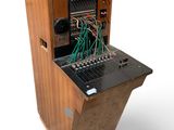 a wooden cabinet with a bunch of wires in it