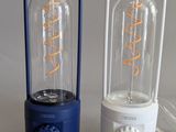 three different types of light bulbs sitting on a table