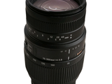 a black camera lens sitting on top of a white background