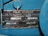 a close up of a blue machine with a label on it