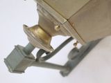 a small metal object that is on a white surface