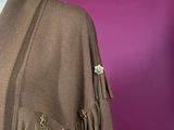 brown cardigan with fringes on a mannequin mannequin mannequin mannequin mannequin mannequin mannequin mannequin