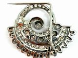silver and white broochle with crystal stones and a pair of scissors