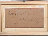 an old picture of a painting with writing on it in a wooden frame