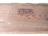 a piece of wood that has some writing on it