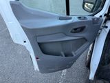 a white truck with a door open on the street