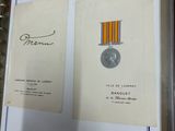 an image of a book with a medal and a medal on it