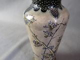 a vase that has a black and white design on it