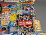 a lot of pokemon comics on the table