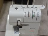 a sewing machine that is sitting on the floor