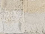 many different types of laces hanging on a rack