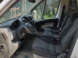 a white van with a black seat in the back of it