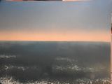 a picture of a picture of the ocean taken from an airplane