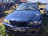two cars parked next to each other in a field